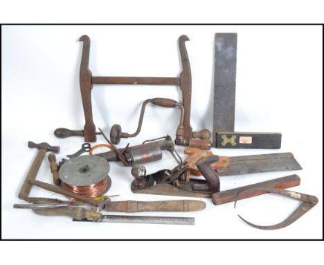 A collection of tools to include some believed 19th and 20th century wooden woodworking tools. To include brass set square, s
