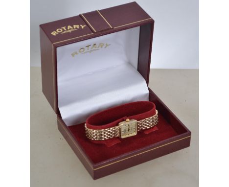 A hallmarked ladies 9ct gold Rotary watch with quartz movement, square champagne dial, gold baton numerals, having a hallmark