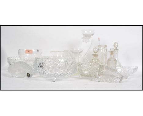 A good collection of cut glass item to include bowls one being etched with flowers and leaves and one having an etched pineap