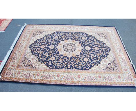 A large Iranian / Persian Keshan carpet - rug having blue &nbsp;ground with geometric decoration and borders. Measures 2.80m 