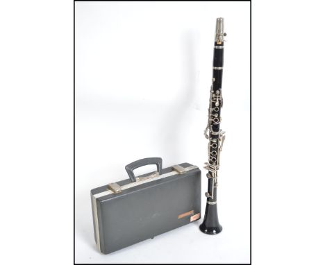 A 20th century cased Boosey and Hawkes Regnent clarinet in it's original fitted case