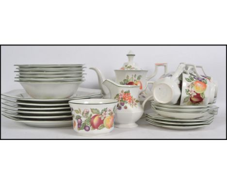 A Johnson's Brothers 6 person tea and dinner service in the fresh fruit pattern consisting of teapot, creamer, sugar bowl, pl