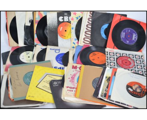 A good collection of vintage 45rpm vinyl records singles to include various artists and labels.