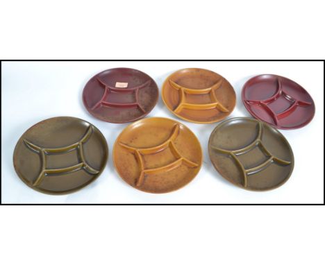 A group of six vintage / retro sectional coloured plates stamped to the base Dexon. Consisting of three coloured pairs. Measu