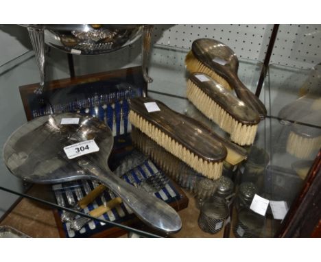 A George V silver dressing table set, engraved with vertical pinstripes, comprising of a  hand mirror, hairbrush, comb, a pai