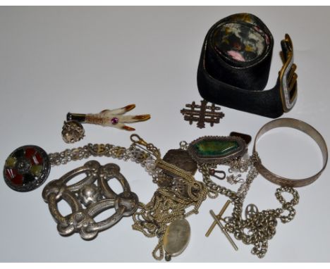 An Elizabeth II silver brooch, fashioned as the Iona Cross, rubbed hallmarks; an Elizabeth II silver bangle, rubbed marks; In