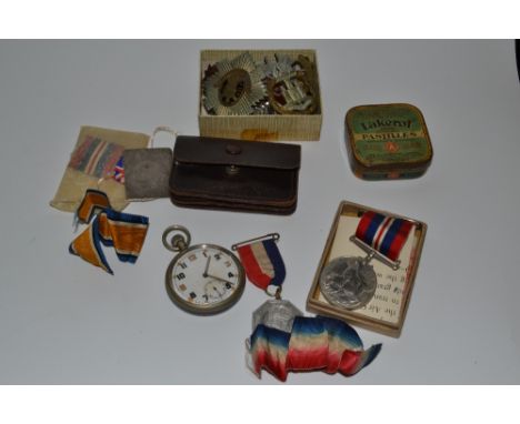 An early 20th century pocket watch, MoD issue arrow to verso; cap badges, including Sherwood Foresters and The Royal Scots, o