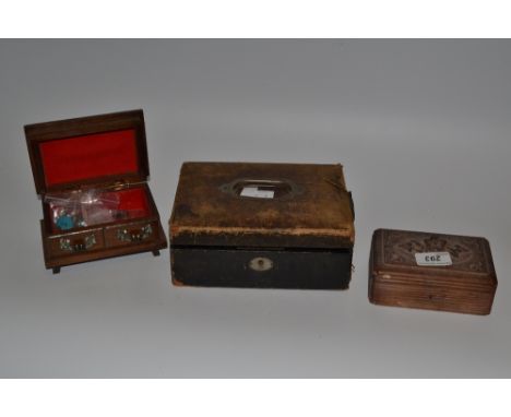 An early 20th century morocco leather jewellery box, the interior with lift-out tray;  a carved wooden trinket box;  etc 