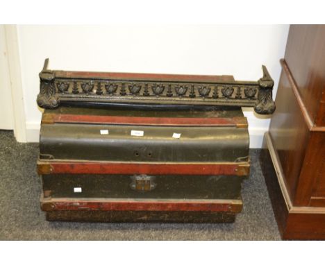 A metal travel trunk, mock wooden bands, a cast iron Coalbrookdale style fender (2)