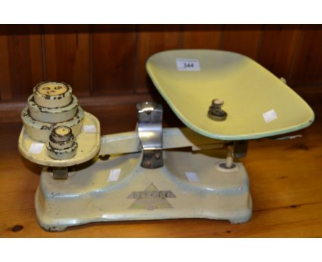 A set of Pecord  kitchen scales, en suite weights 2lb to  1oz; others 