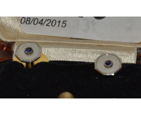 A pair of 9ct gold and enamel dress studs, cased