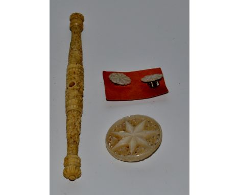 A Cantonese bone lace maker's bobbin; an early 20th century mother of pearl star burst circular brooch; a similar pair of cli