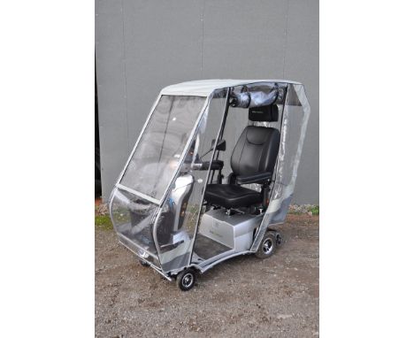 A QUINGO VITESS 2 MOBILITY SCOOTER, 4.8 miles on clock, with various added extras, including comfort+, ARC canopy, and rear c