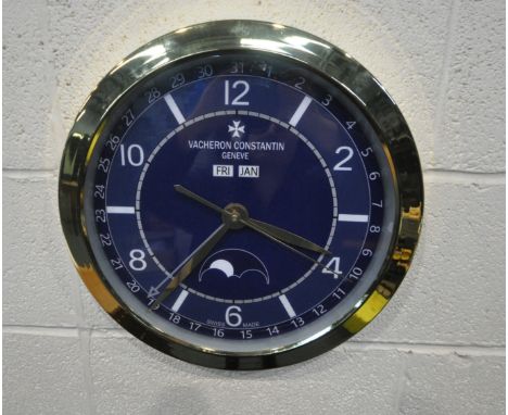 A VACHERON CONSTANTIN GENEVE DEALERS ADVERTISING WALL CLOCK, with a blue dial, diameter 40cm (condition report: untested, ove