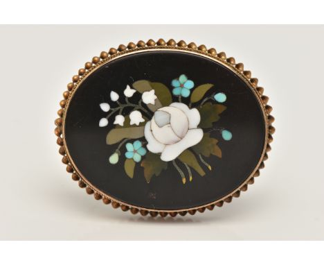 A PIETRA DURA BROOCH, of an oval form depicting flowers, collet set with a rope twist surround, fitted with a brooch pin and 