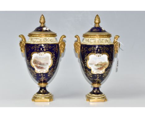 A PAIR OF COALPORT COVERED VASES, of urn form with twin gilt ram's head handles, on a square pedestal base, painted with vign