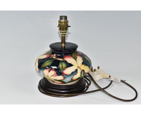 A MOORCROFT POTTERY 'SILK FLOWER' TABLE LAMP, possibly a trial piece, by Anji Davenport, of squat form, tube lined with pale 