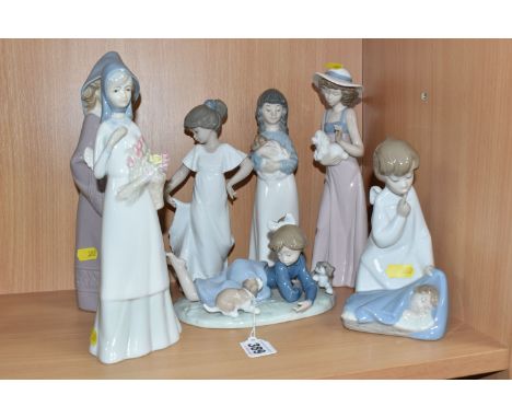 A GROUP OF SEVEN LLADRO, NAO, AND SIMILAR FIGURES to include two Lladro figurines comprising 'Playful Romp' designed by Franc