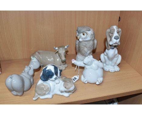 A GROUP OF NAO SCULPTURES, comprising Daisa, Bull lying down, Short-eared Owl, height 18cm, Wake up Spaniel puppies, Hippopot