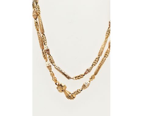 A VICTORIAN YELLOW METAL LONG GUARD CHAIN WITH HAND CLASP, fancy link chain made up of open work links and textured chain lin