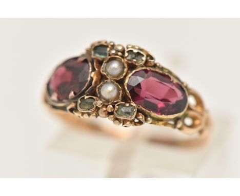 A VICTORIAN GARNET, EMERALD AND SPLIT PEARL RING, set with two oval cut garnets, four very small emeralds and two split pearl