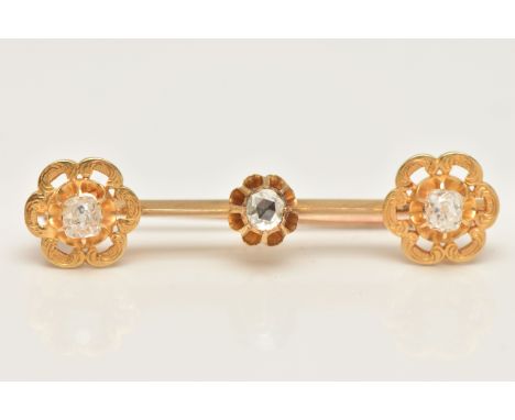 A YELLOW METAL DIAMOND SET BROOCH, bar brooch set with a central rose cut diamond measuring approximately 3.6mm diameter, in 