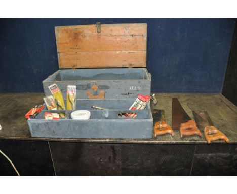 A VINTAGE WOODEN TOOLCHEST CONTAINING TOOLS including three spear and Jackson saws, Elliott pliers, wire snips, and long nose