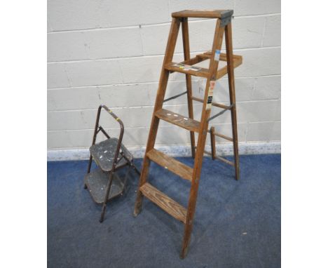 A SET OF WOODEN FOLDING STEP LADDERS, height 5ft, along with a small set of metal ladders (condition report: marks, scuffs, s