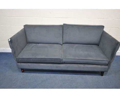 A BLUE PLUSH VELVET DEEP SOFA, with buttoned sides, length 204cm x depth 90cm x height 87cm (condition report: ideal for a sl
