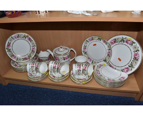 A ROYAL WORCESTER DINNERWARE 'ROYAL GARDEN', comprising  a raised cake plate, a cake plate, eight dinner plates (two plates a
