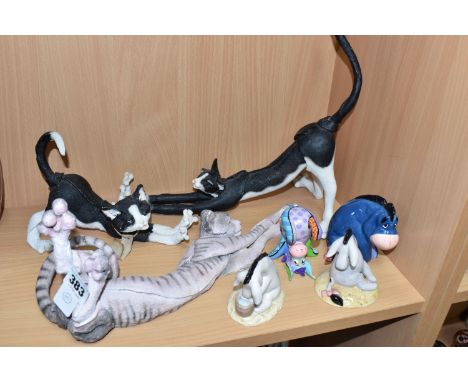 A GROUP OF DECORATIVE SCULPTURES, comprising of three Country Artists 'A Breed Apart' Cats a large stretching black and white