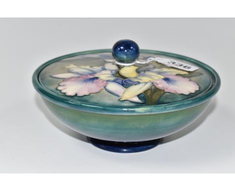 A MOORCROFT POTTERY 'ORCHID' PATTERN COVERED BOWL, tube lined with blue and purple orchids on a graduated green blue ground, 
