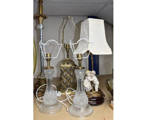 A GROUP OF TABLE LAMPS, comprising a pair of cut glass based table lamps, height to top of fitting 30cm (one has a tiny hole 