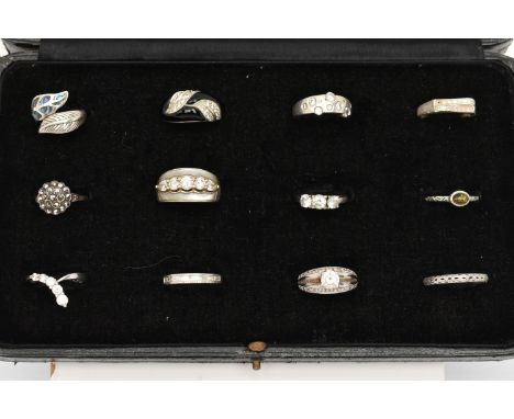 TWELVE WHITE METAL RINGS, twelve white metal dress rings, some set with cubic zirconia, each stamped 925 or silver, approxima