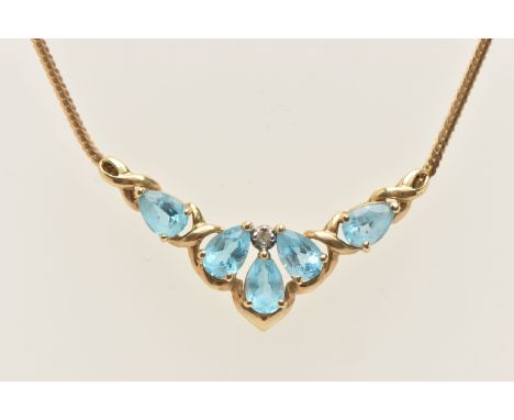 A 9CT GOLD TOPAZ AND DIAMOND NECKLACE, the V shape pendant set with five pear cut blue topaz and a single cut diamond, each c