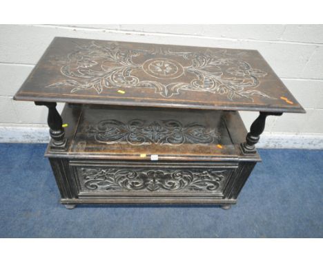 A 20TH CENTURY OAK MONKS BENCH, with a tilting backrest, raised on turned supports, a hinged seat, on bun feet, width 108cm x