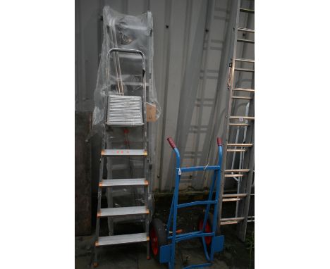A FACTORY WRAPPED YOUNGMAN DELUXE  STAIRWAY LOFT LADDER (wrapping torn and partially open) along with another step ladder and