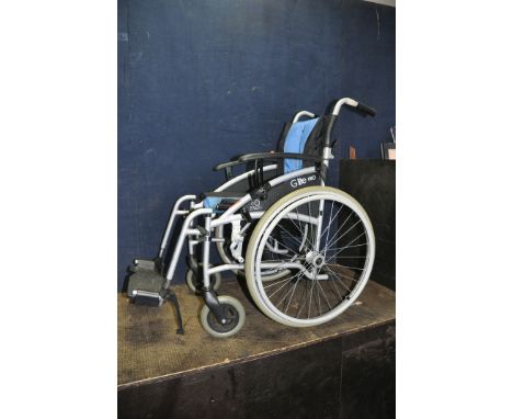 AN EXCEL VAN OS G LITE PRO FOLDING WHEELCHAIR with two footrests