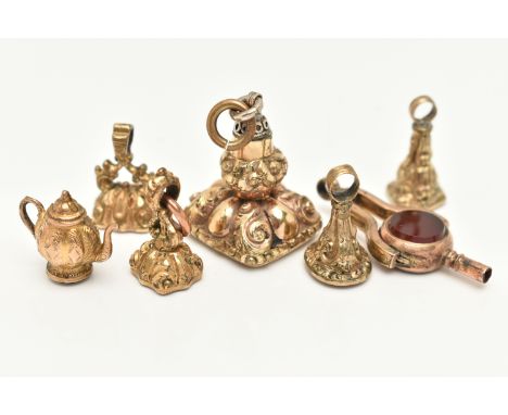 A SELECTION OF GOLD PLATED FOB SEALS, A SWIVEL WATCH KEY AND A CHARM, to include a larger square shaped fob seal set with a p