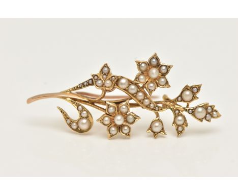 A YELLOW METAL CULTURED PEARL SET BROOCH, of a floral design, set with small seed and split pearls, stamped 15ct, fitted with