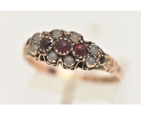 A LATE VICTORIAN 9CT GOLD RING, set with five graduating very worn red paste stones, within a surround of possibly Chalcedony