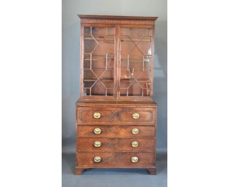 A Regency Mahogany Secretaire Bookcase, the moulded cornice above two astragal glazed doors enclosing shelves, the lower sect