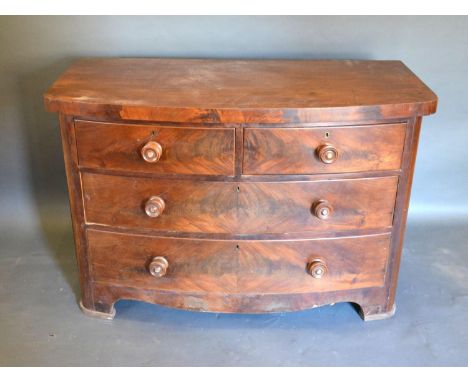 A Victorian Mahogany Bow Fronted Chest of Drawers, the moulded top above two short and two long drawers with circular knob ha