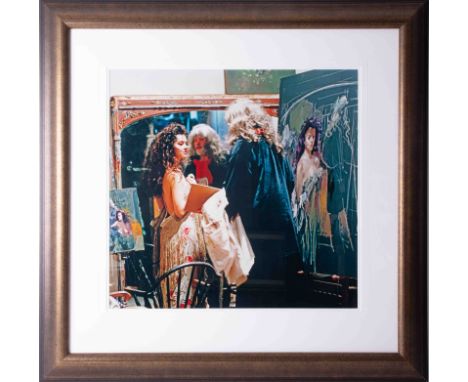 A print of an original photograph of Robert Lenkiewicz and Lisa in his studio, 49cm x 52cm, framed and glazed.