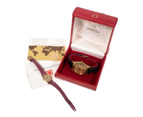 OMEGA: A GENEVE GOLD PLATED GENTLEMAN'S WRISTWATCH with manual wind movement, gold dial, gold baton numerals, and gold hands,