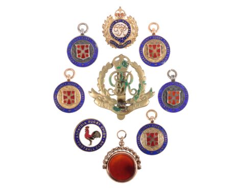 THREE 9CT GOLD AND ENAMEL RUGBY MEDALS together with one unmarked yellow metal " Royal Engineers" badge, one 9ct gold swivel 