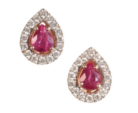 A PAIR OF RUBY AND DIAMOND EARRINGS each central pear-cut ruby within  a border of diamonds, set in 18ct yellow gold