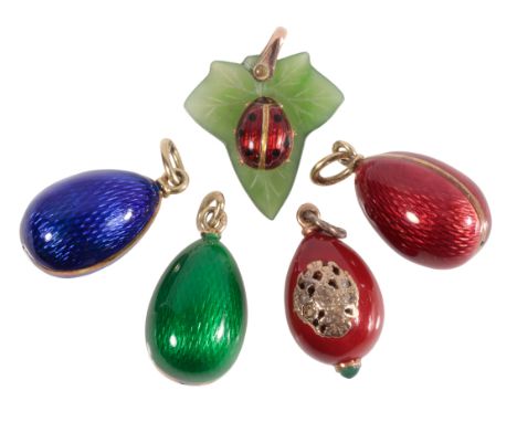 FABERGE: AN EGG PENDANT decorated with an unmarked yellow metal crest, set with four old-cut diamonds, the suspension loop wi