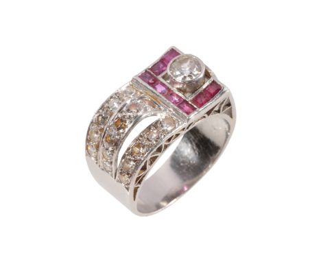 AN ART DECO DIAMOND &amp; RUBY RING the brilliant-cut diamond c.0.20ct, side-set to three rows of rubies and three rows of br