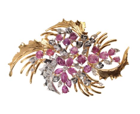 A DIAMOND AND RUBY SPAY BROOCH set in unmarked yellow and white metal, 7cm x 4.2cm, approx 26.9grams total weight